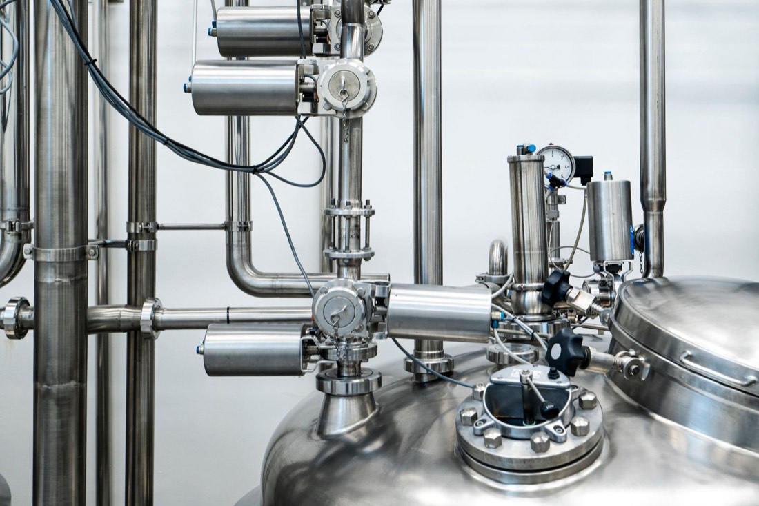 Stainless steel process vessels and pipework in a production suite